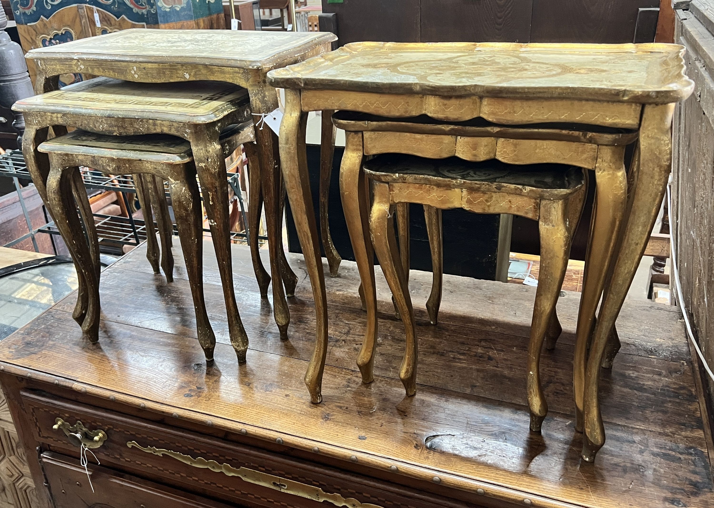 Two nests of painted giltwood tea tables, larger width 54cm, height 57cm